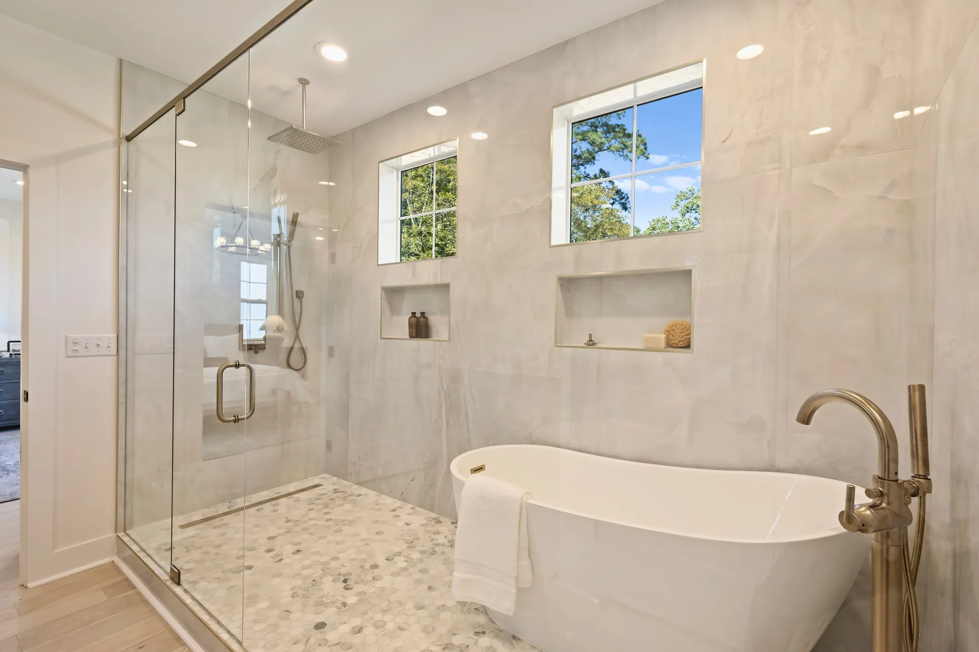 Bathroom with tub and shower at the completed 567 Lyttleton Dr home.