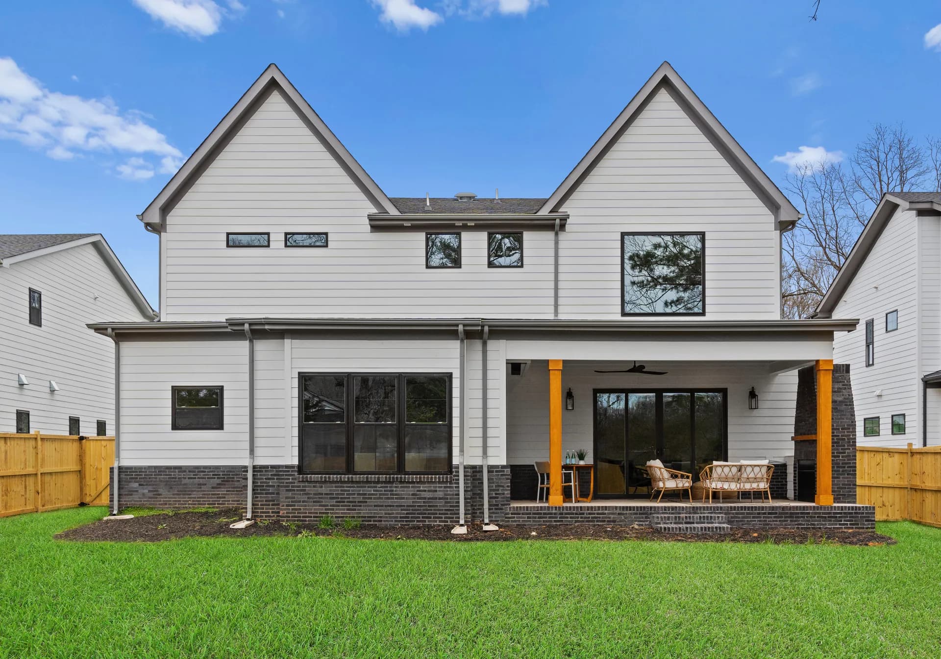 Rear exterior and lawn at the completed 567 Lyttleton Dr home